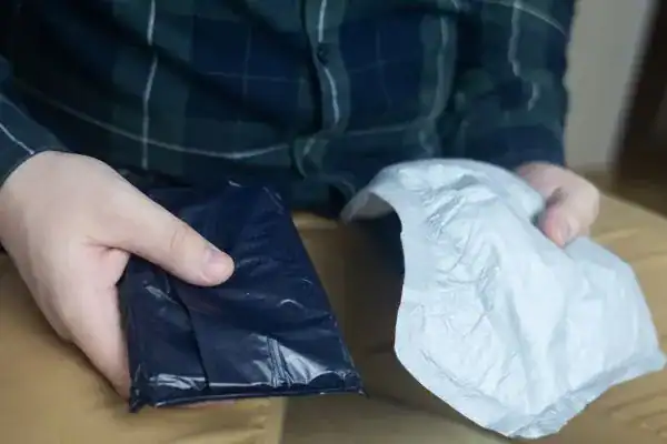 image of man holding stool incontinence Manchester products